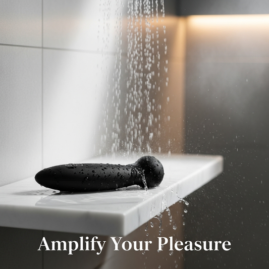A sleek, waterproof vibrator rests on a marble ledge in a modern shower, with water droplets splashing on it, illustrating the concept for an article titled "The Ultimate Guide to Water Play: Using Vibrators in the Shower & Bathtub".